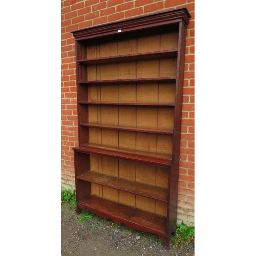 835 - A Georgian mahogany tall open bookcase comprising two loose height adjustable shelves over three fix... 