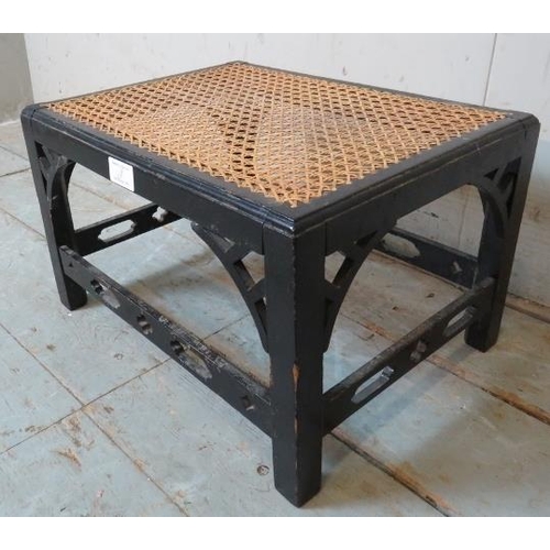 837 - A ebonised bergere footstool with pierced stretchers in the Arts & Crafts taste.
Condition report: V... 