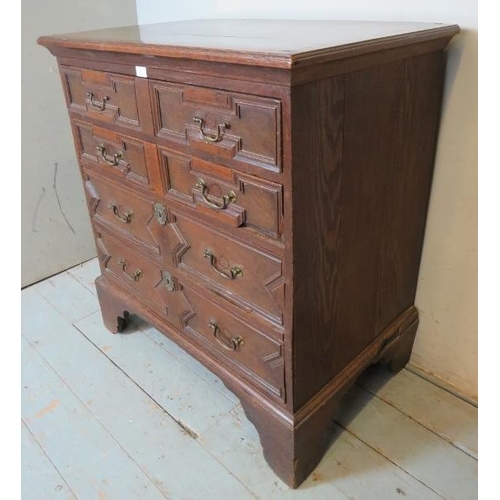 843 - An antique oak chest of drawers in a 17th century Jacobean style, comprising four graduated long dra... 