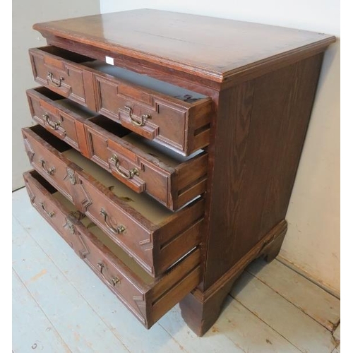 843 - An antique oak chest of drawers in a 17th century Jacobean style, comprising four graduated long dra... 