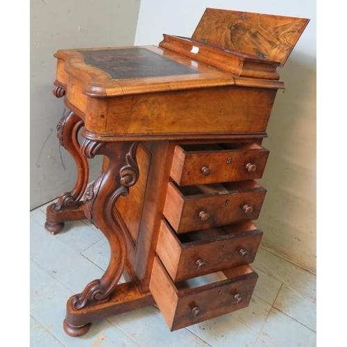 849 - A 19th century walnut Davenport with satinwood lined fitted interior, four graduated drawers to one ... 