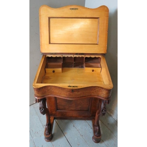 849 - A 19th century walnut Davenport with satinwood lined fitted interior, four graduated drawers to one ... 