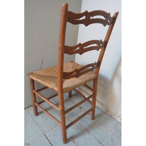 850 - A 19th century country made elm occasional chair with tapering uprights & shaped and pierced back, r... 