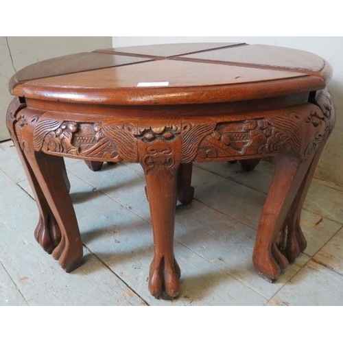 857 - Four vintage Chinese hardwood nesting tables with carved frieze depicting dragons & figural scenes, ... 