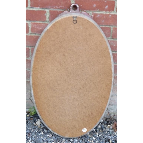 858 - A vintage bevelled oval gilt framed wall mirror with moulded foliate decoration to cornice.
Conditio... 