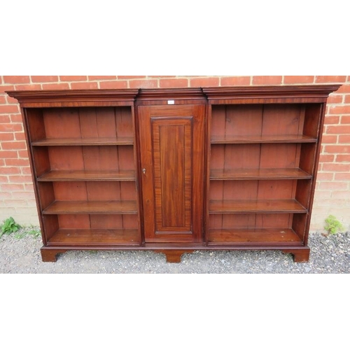 864 - A Georgian mahogany reverse breakfront bookcase, inlaid and crossbanded, housing an array of eight f... 