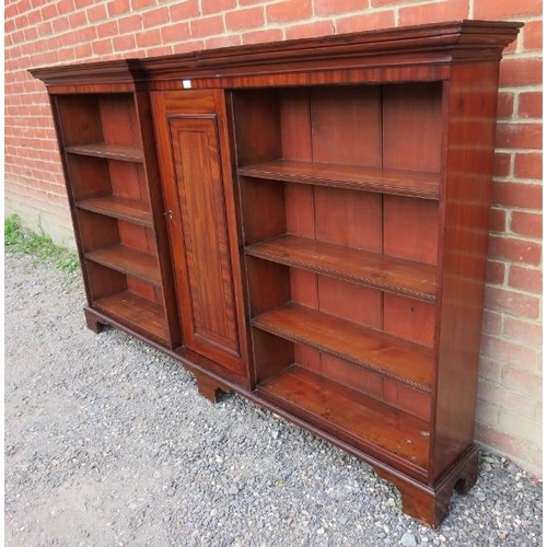 864 - A Georgian mahogany reverse breakfront bookcase, inlaid and crossbanded, housing an array of eight f... 