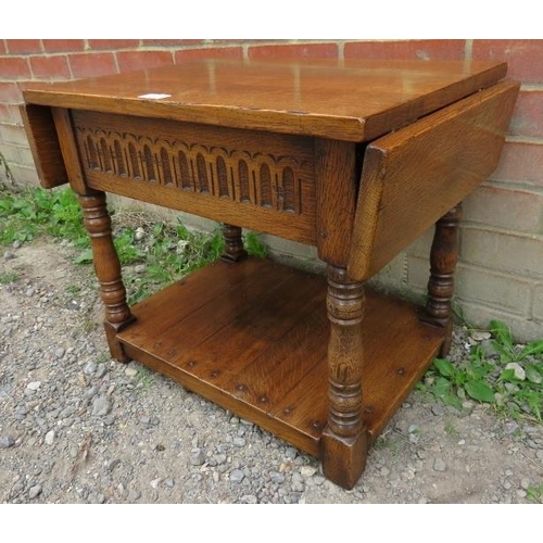 869 - A good quality reproduction solid oak period style small drop leaf two tier occasional table.
Condit... 