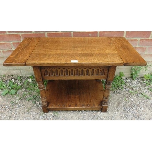 869 - A good quality reproduction solid oak period style small drop leaf two tier occasional table.
Condit... 