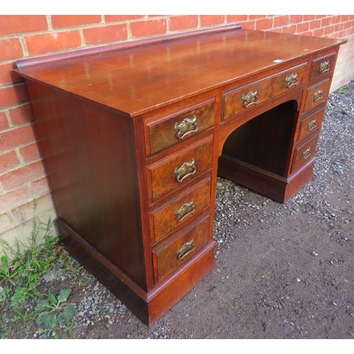 893 - A late Victorian mahogany & burr walnut kneehole desk, having a configuration of nine graduated oak ... 