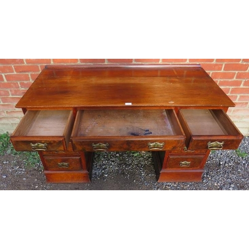 893 - A late Victorian mahogany & burr walnut kneehole desk, having a configuration of nine graduated oak ... 