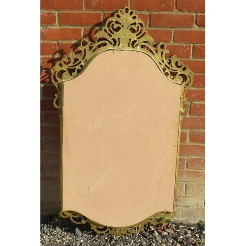 911 - An ornate gilt metal framed wall mirror in the Rococo taste.
Condition report: No issues.
122cm high... 