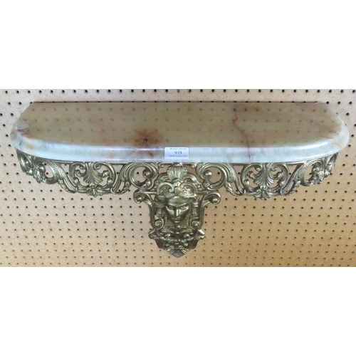 919 - A marble topped gilt metal bracket wall shelf, ornately cast with scrolled motifs in the Rococo tast... 