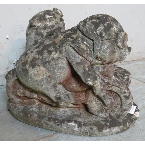 933 - A nicely weathered reconstituted stone garden ornament in the form of pigs riding a motorcycle & sid... 