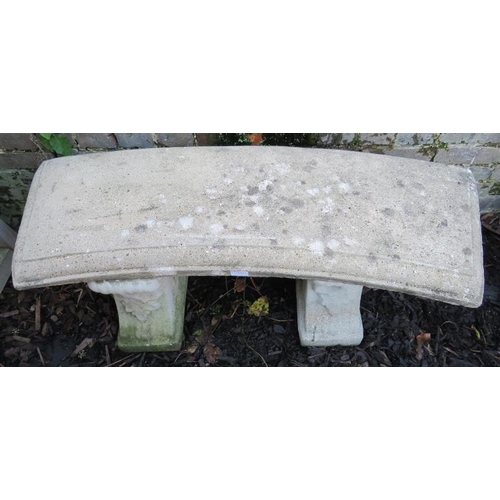 939 - A reconstituted stone garden seat with carved top raised on carved end supports.
Condition report: N... 