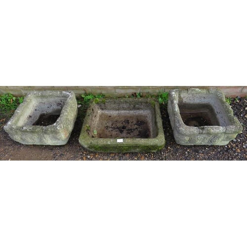 942 - A nicely weathered reconstituted stone sink, together with two nicely weathered stone planters.
Pair... 