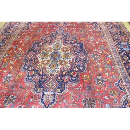 951 - A fine antique Persian Kashan carpet on red ground and blue borders. 340cm x 230cm.
Condition report... 