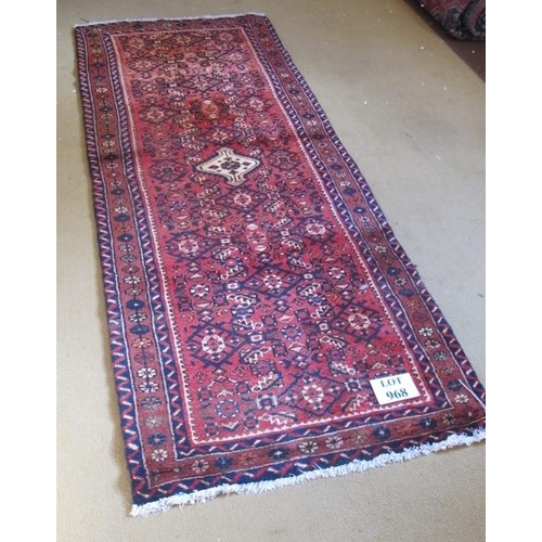 968 - A Persian Hamadan runner cream central motif on claret ground. 217cm x 85cm.
Condition report: Good ... 