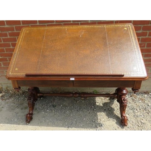 889 - A Victorian architect's desk with adjustable drawing surface, inset with brown tooled leather over a... 