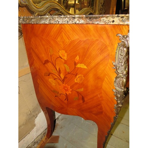 703 - A reproduction 19th century style French tulipwood commode chest featuring black serpentine marble t... 