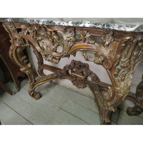 727 - A very ornate serpentine front console table in the Renaissance taste with black Italian marble top,... 