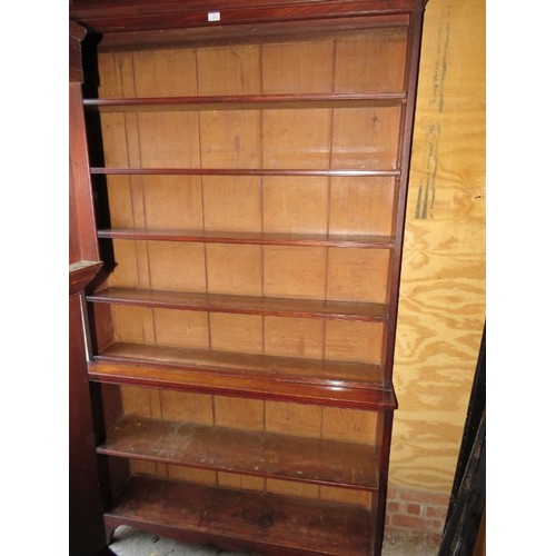 835 - A Georgian mahogany tall open bookcase comprising two loose height adjustable shelves over three fix... 