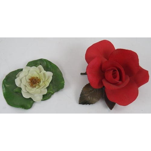 47 - A hand decorated cabinet plate in Coalport style, two porcelain flowers, a Rosenthal porcelain hedge... 