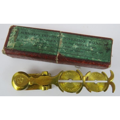 101 - A set of Victorian Simmons Sovereign scales, a set of brass pocket scales in a toleware case and a 1... 