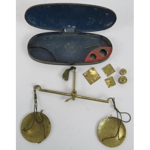 101 - A set of Victorian Simmons Sovereign scales, a set of brass pocket scales in a toleware case and a 1... 