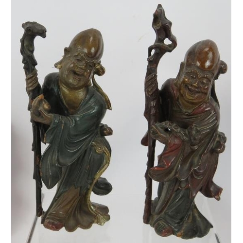 103 - Seven carved wood oriental figures including two Chinese Deities with polychrome decoration plus two... 