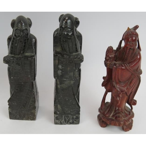 103 - Seven carved wood oriental figures including two Chinese Deities with polychrome decoration plus two... 