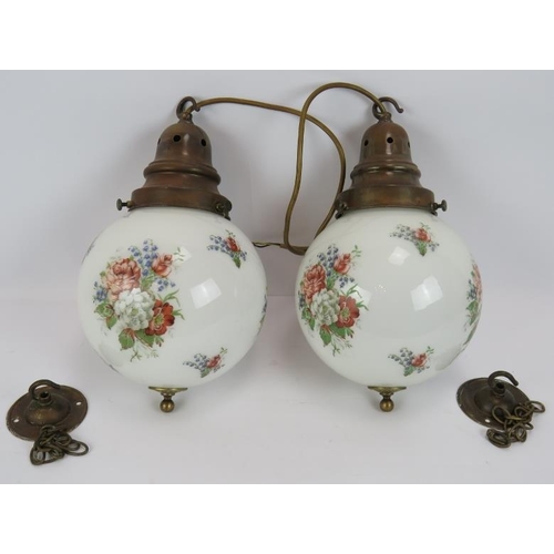 109 - A pair of vintage opaline globe lights with transfer printed flowers & brass fittings (20cm diameter... 