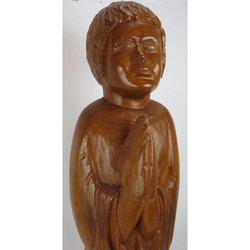 111 - A large hardwood chip carved figure of a chorister praying. Height 95cm.
Condition report: Natural s... 