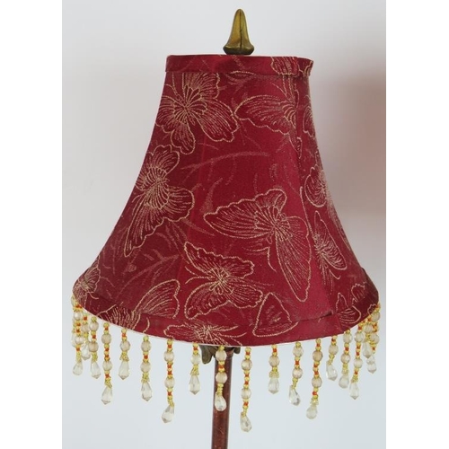 118 - A pair of contemporary Rococo style lamps with dark red & gold effect metal bases and beaded crimson... 