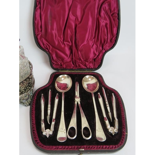 119 - A silver plated cased grape & nut set by Walker & Hall, a cased set of 12 teaspoons & tongs, a cut g... 