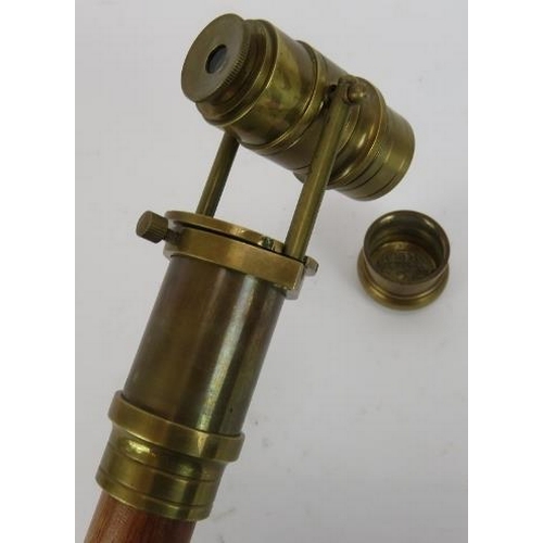 125 - A contemporary telescope walking stick. Hardwood shaft mounted with folding brass telescope. Length ... 