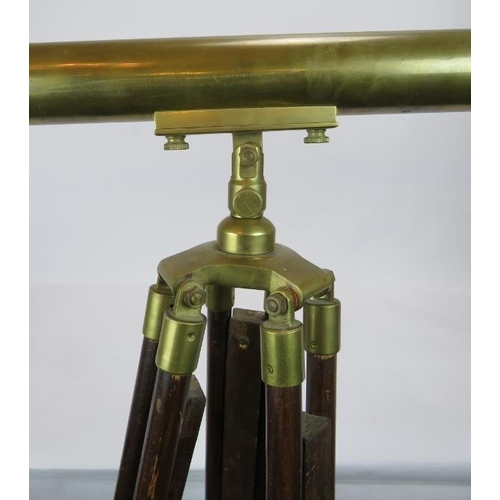 126 - A contemporary brass telescope on adjustable wooden tripod. Telescope length 104cm.
Condition report... 