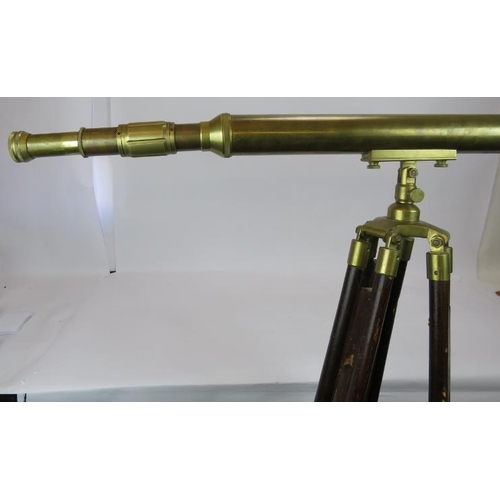 126 - A contemporary brass telescope on adjustable wooden tripod. Telescope length 104cm.
Condition report... 