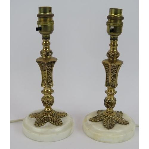 128 - A pair of ornate gilt brass & white metal marble lamps plus a single brass candlestick lamp (3). Tal... 