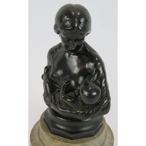 134 - A bronzed Spelter figure of a mother & child mounted on a turned marble base. Height 19cm.
Condition... 