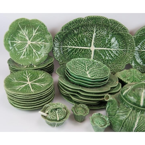 136 - A large quantity of mainly Portuguese ceramics fashioned as cabbage leaves including a tureen and te... 