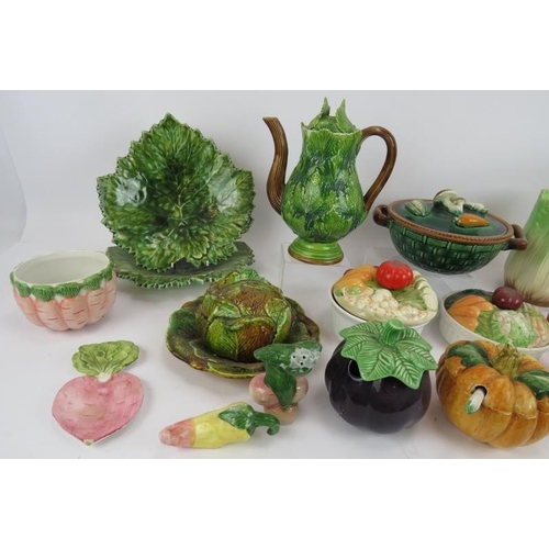 144 - A quantity of vegetable shaped table ware including a coffee pot, cruets and covered dishes (qty).
C... 