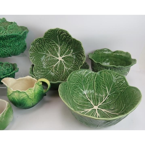 147 - A quantity of Majolica style ceramics fashioned in cabbage leaf designs including four covered turee... 