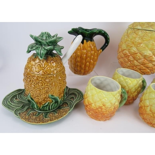 148 - A quantity of Portuguese & Italian ceramics fashioned as pineapples including a five piece mug set a... 