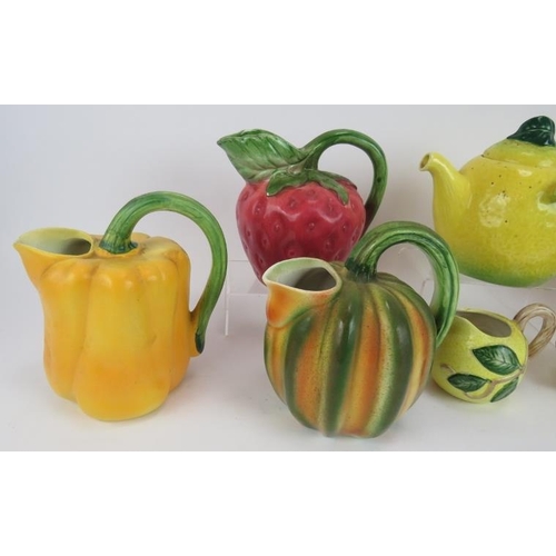 149 - Five Majolica style jugs fashioned as various fruit & vegetable plus a three piece lemon form tea se... 