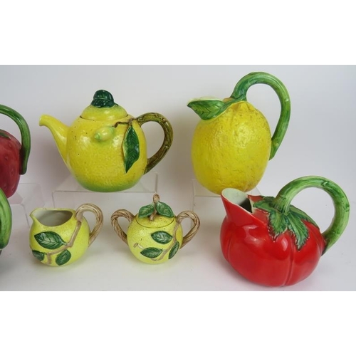 149 - Five Majolica style jugs fashioned as various fruit & vegetable plus a three piece lemon form tea se... 