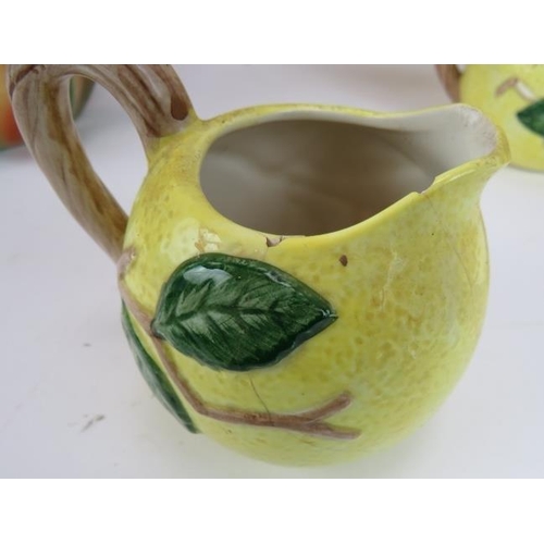 149 - Five Majolica style jugs fashioned as various fruit & vegetable plus a three piece lemon form tea se... 