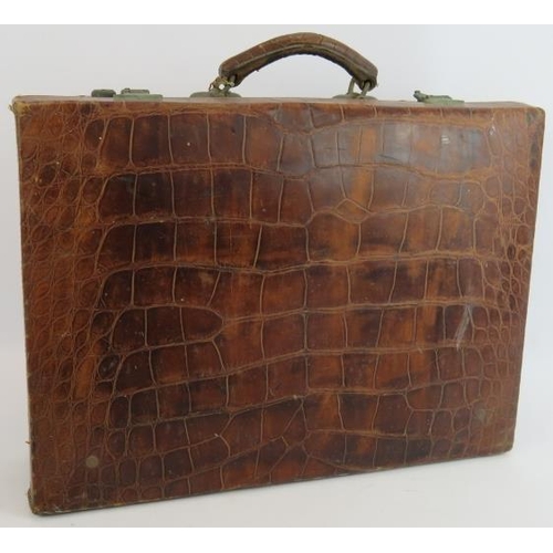 155 - A vintage crocodile leather suitcase by Moritz Madler Leipzig with fitted interior. 50cm x 36cm x 12... 