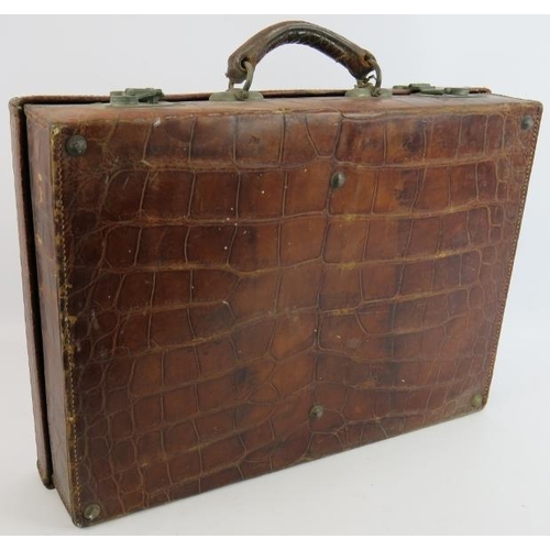 155 - A vintage crocodile leather suitcase by Moritz Madler Leipzig with fitted interior. 50cm x 36cm x 12... 