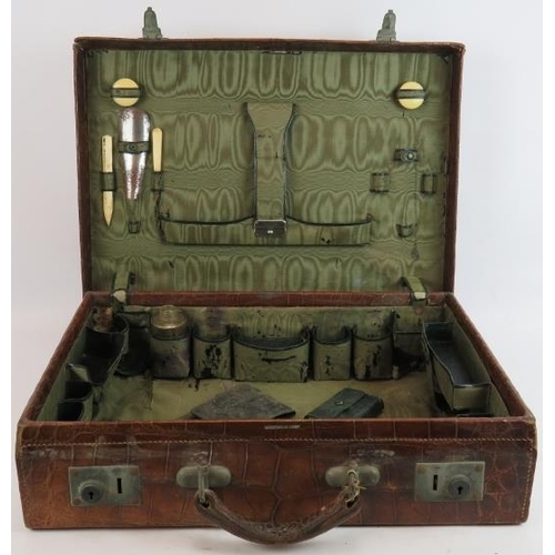 155 - A vintage crocodile leather suitcase by Moritz Madler Leipzig with fitted interior. 50cm x 36cm x 12... 